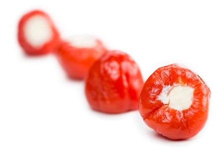 Fresh made Red Pepper (stuffed with cheese) isolated on white background (close-up shot)