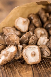 Portion of fresh Shiitake mushrooms close-up shot, selective focus