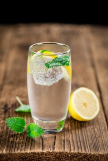Lemonade on a vintage background as detailed close-up shot (selective focus)