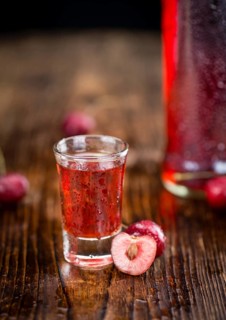 Some homemade Cherry Liqueur as detailed close-up shot, selective focus
