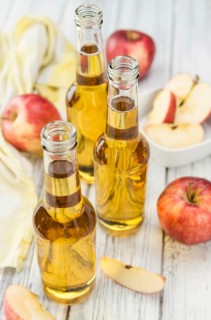 Apple Cider on a vintage background as detailed close-up shot (selective focus)