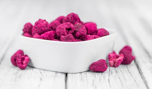 Dried Raspberries on a vintage background as detailed close-up shot, selective focus