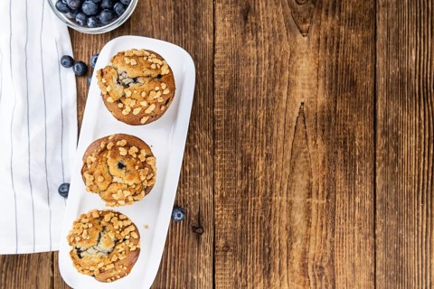 Fresh Blueberry Muffins as detailed close-up shot (selective focus)