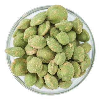 Portion of Wasabi Peanuts (as close-up shot) isolated on white background