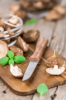 Portion of fresh Shiitake mushrooms close-up shot, selective focus