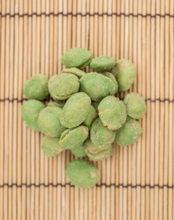 Wasabi Peanuts on a vintage background as detailed close-up shot (selective focus)