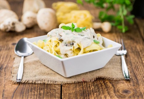 Homemade Porcini pasta on vintage background selective focus, close-up shot