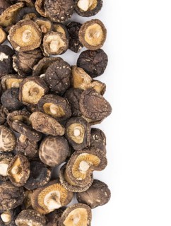 Portion of Dried Shiitake as detailed close-up shot isolated on white background