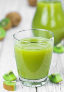 Kiwi Smoothie (selective focus) on an old and vintage background (homemade)