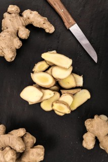 Slate slab with Ginger Slices (selective focus, close-up shot)