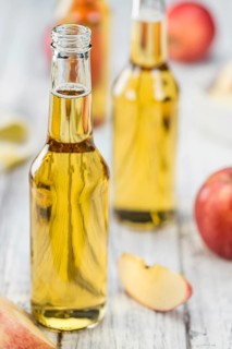 Apple Cider on a vintage background as detailed close-up shot (selective focus)
