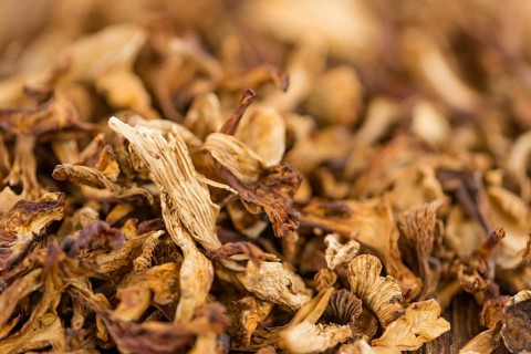 Fresh made Dried Chanterelles on a vintage background as detailed close-up shot