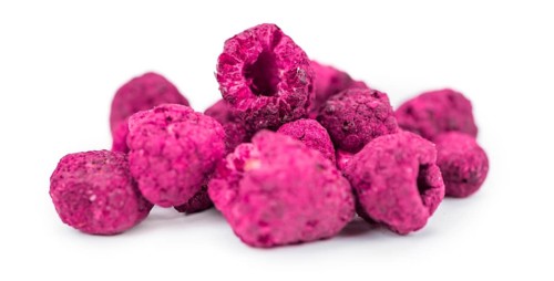 Fresh made Raspberries (dried) isolated on white background, close-up shot