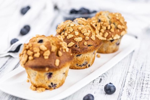 Fresh Blueberry Muffins as detailed close-up shot (selective focus)