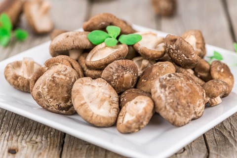 Portion of fresh Shiitake mushrooms close-up shot, selective focus