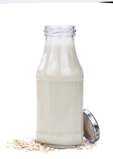 Oat Milk isolated on white background (selective focus, close-up shot)
