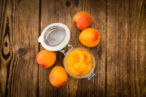 Pickled Apricots on a vintage background as detailed close-up shot (selective focus)
