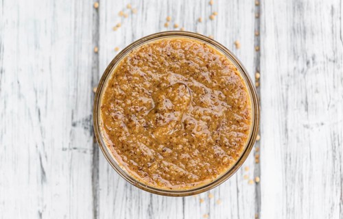 Sweet Mustard on a vintage background as detailed close-up shot (selective focus)