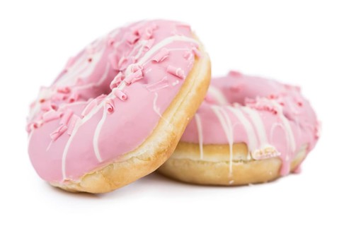 Some fresh made Donuts isolated on white background (close-up shot)