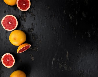 Chopped Grapefruits (selective focus) on a vintage background as detailed close-up shot