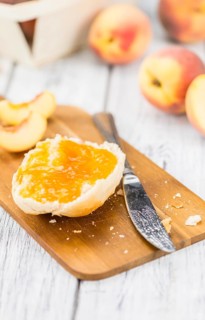 Peach Jam on a vintage background as detailed close-up shot, selective focus