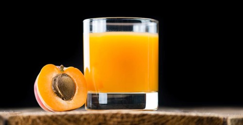 Some homemade Apricot Juice (selective focus) as detailed close-up shot