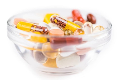 Drugs as detailed close-up shot (selective focus) isolated on white background