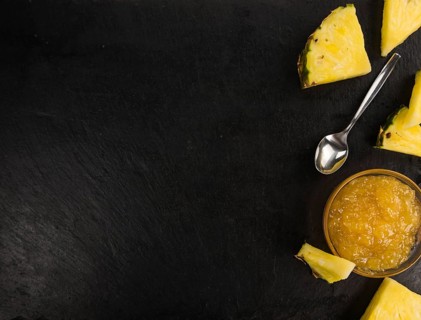 Portion of Pineapple Jam on a rustic slate slab, selective focus, close-up shot