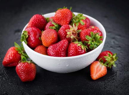 Strawberries on a vintage background as detailed close-up shot, selective focus