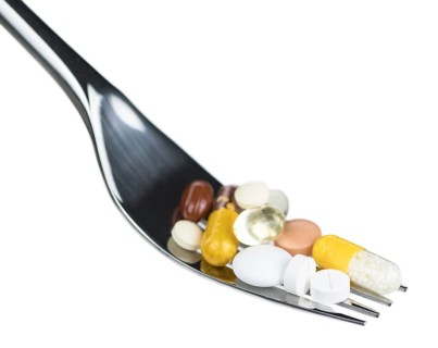 Drugs prepared as meal (close-up shot, selective focus) isolated on white background