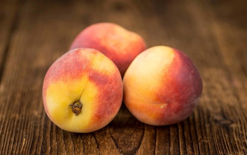 Portion of fresh Peaches close-up shot, selective focus