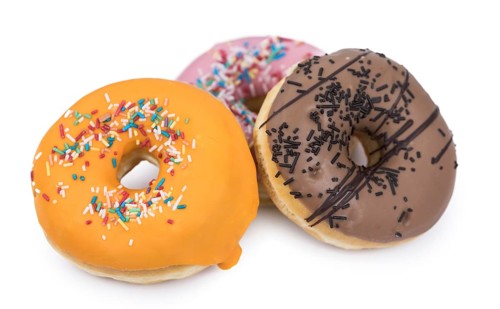 Fresh made Donuts isolated on white background (selective focus)