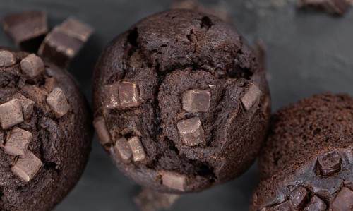 Fresh Chocolate Muffins as detailed close-up shot (selective focus)