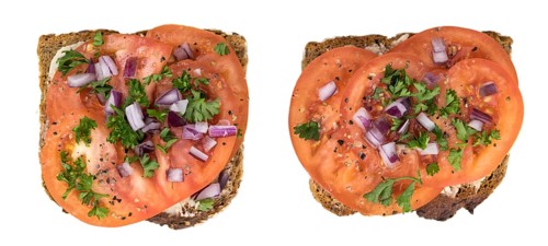 Portion of Tomato Sandwich isolated on white background (selective focus)