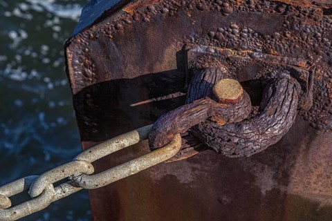 Rusted anchor pin along the Pensacola Bay seawall at the Vince Whibbs Sr. Community Maritime Park