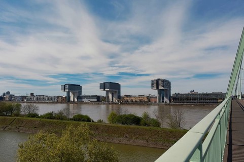 View over the Rhine with crane houses, Cologne, Germany, Europe