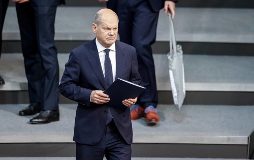 Federal Chancellor Olaf Scholz arrives at a session of the Bundestag to make a government