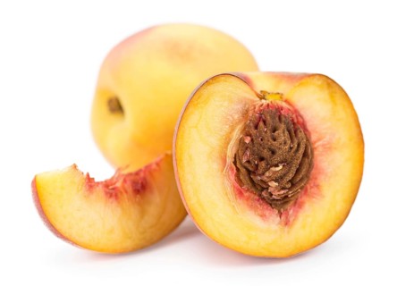 Portion of Peaches as detailed close-up shot isolated on white background