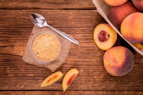 Ground Peaches on a vintage background as detailed close-up shot, selective focus