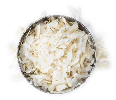 Portion of Coconut Chips isolated on white background (selective focus)