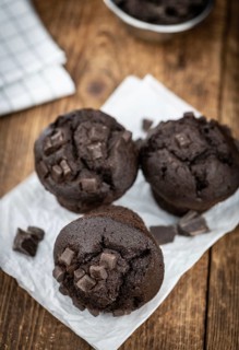 Fresh Chocolate Muffins as detailed close-up shot (selective focus)