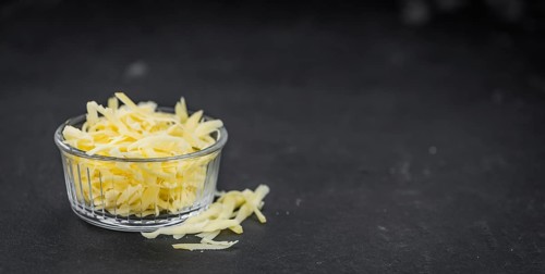 Fresh made Grated Cheese as detailed close-up shot