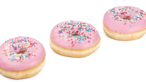 Fresh made Donuts isolated on white background (selective focus)