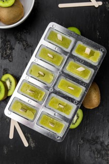 Kiwi Popsicles (fresh) as detailed close-up shot, selective focus)