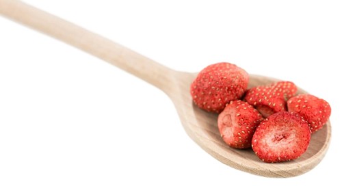 Portion of Dried Strawberries as detailed close-up shot isolated on white background