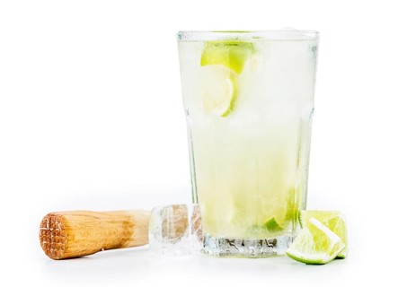 Caipirinha isolated on white background (selective focus, close-up shot)