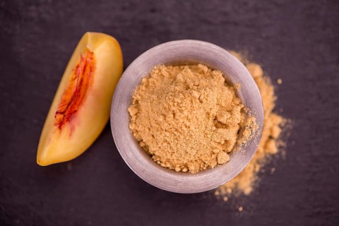 Portion of fresh Ground Peaches close-up shot, selective focus