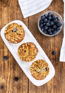 Some fresh Blueberry Muffins (selective focus, close-up shot)
