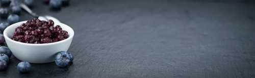 Preserved Blueberries on a vintage background as detailed close-up shot, selective focus