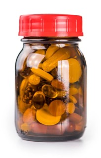 Mixed drugs isolated on white background as detailed close-up shot (selective focus)